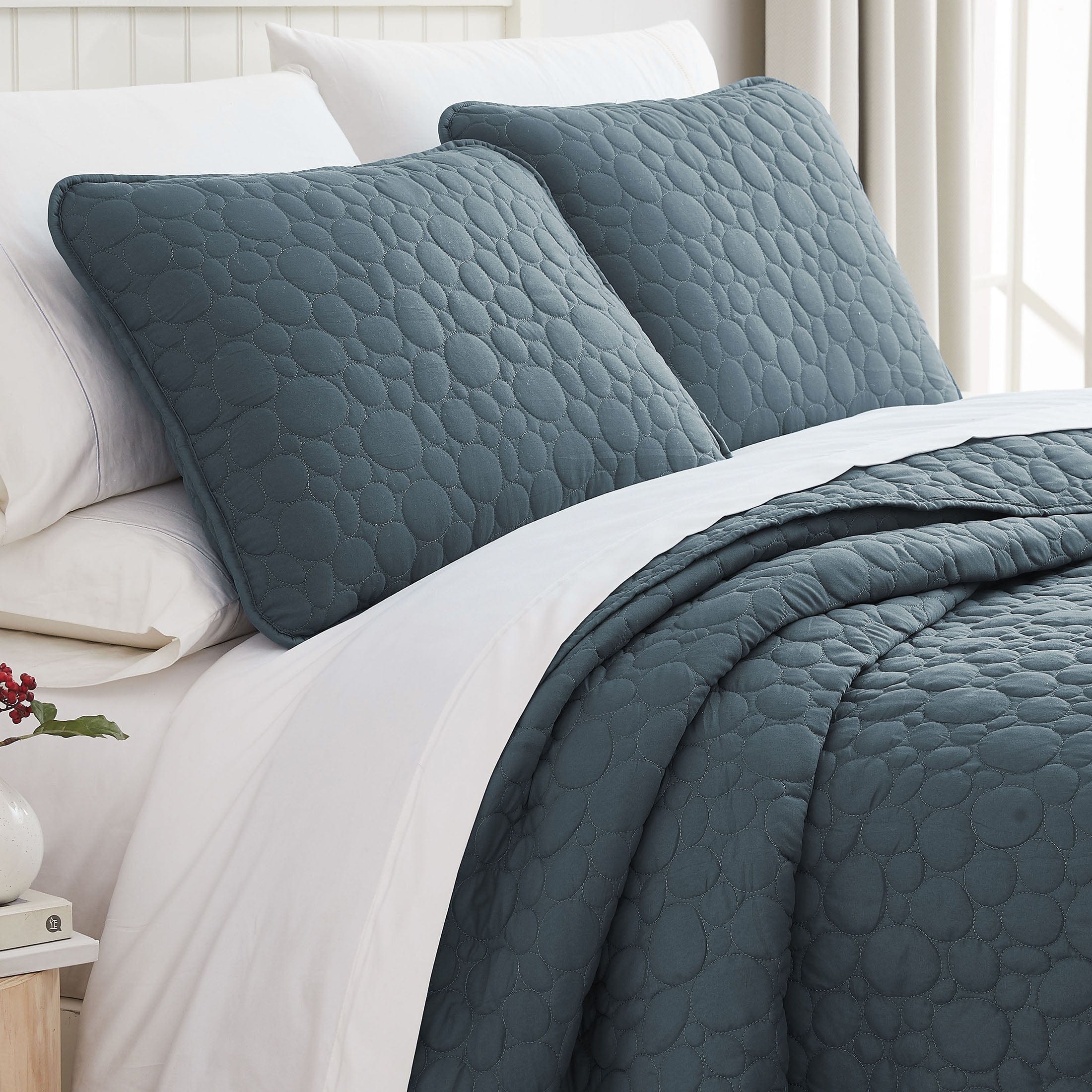 Angled View of Pebble Oversized Quilt Set in Blue Mirage#color_pebbles-blue-mirage