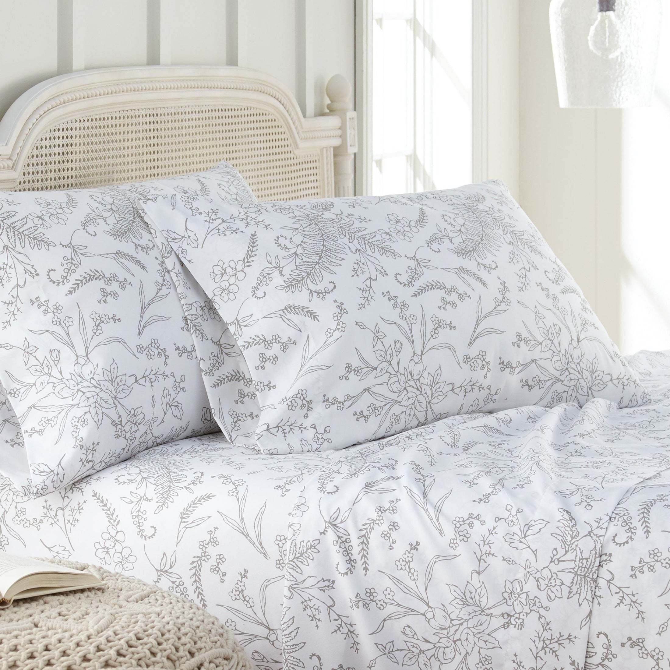 Angled View of Winter Brush Pillow Cases in White and Steel Grey Flowers#color_winter-brush-white-with-steel-gray-flowers