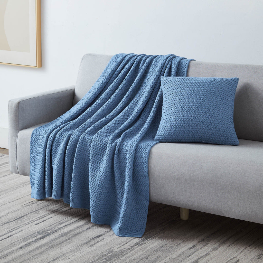 Angled View of Arcylic Throw Set in Blue on Sofa#color_acrylic-blue