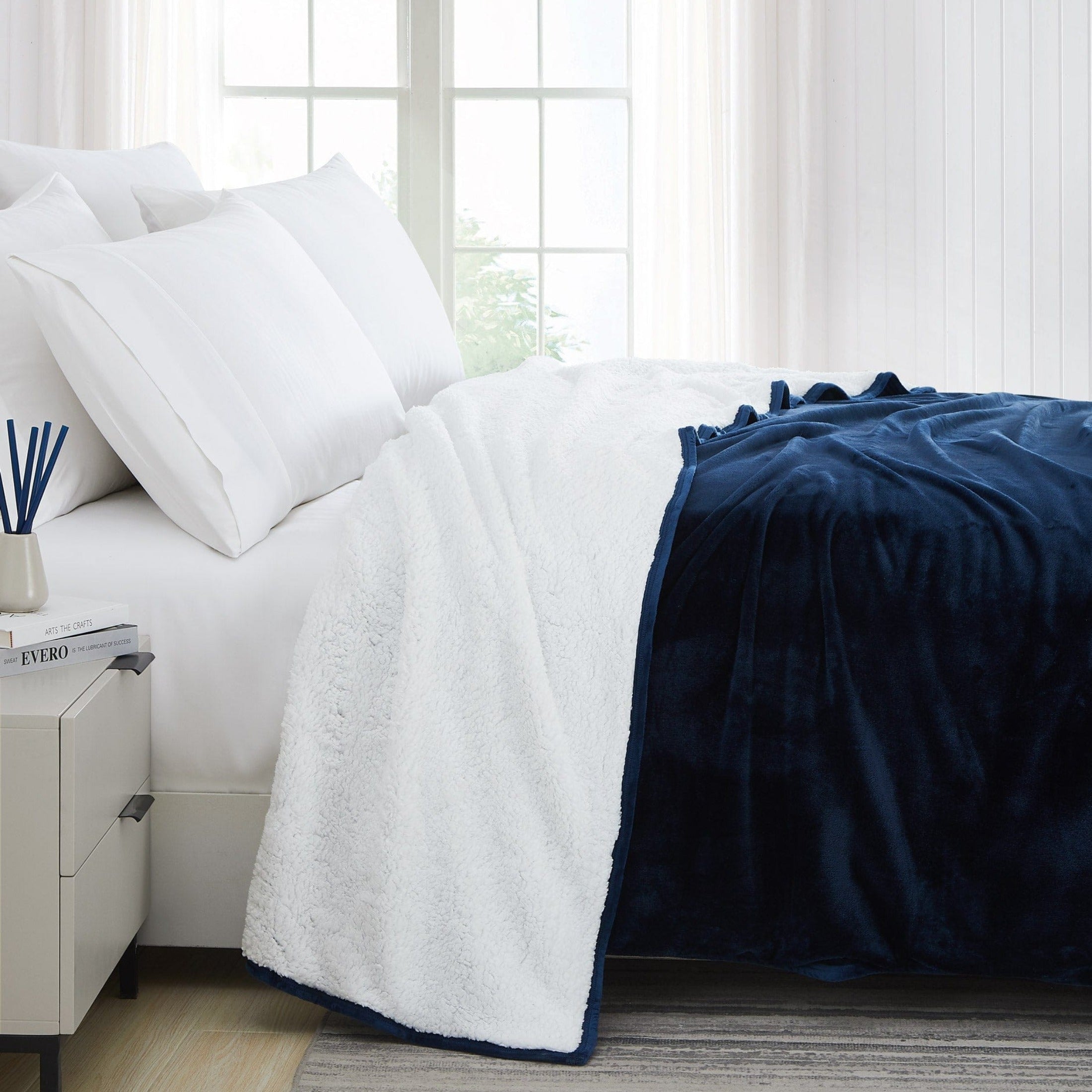 Side View of Sherpa-Fleece Oversized Reversible Blankets and Throws in Navy Blue#color_microfleece-navy-blue