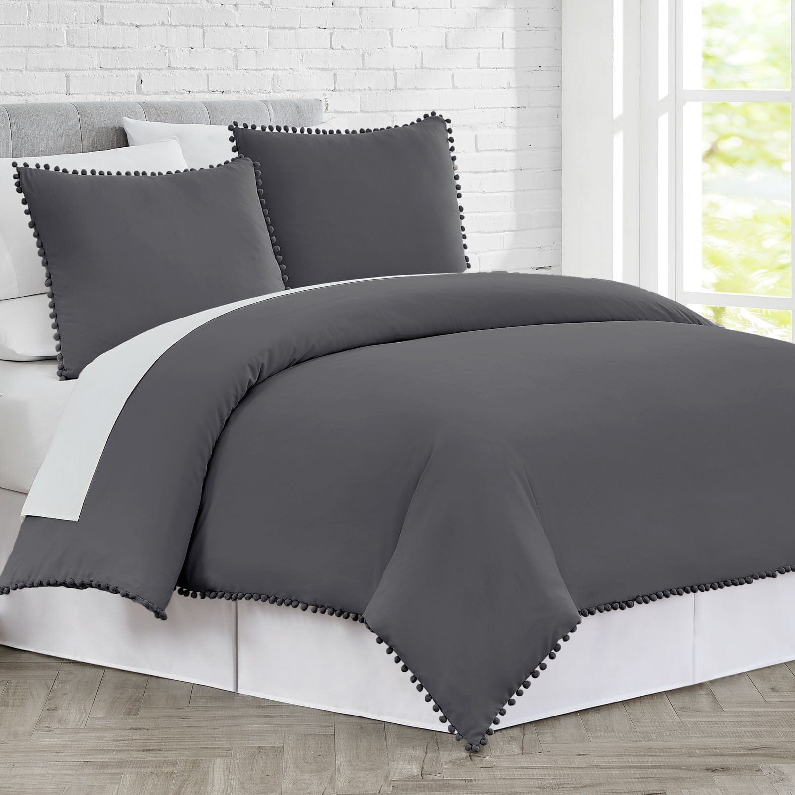 Side View of Pom-Pom Duvet Cover Set in Slate#color_slate