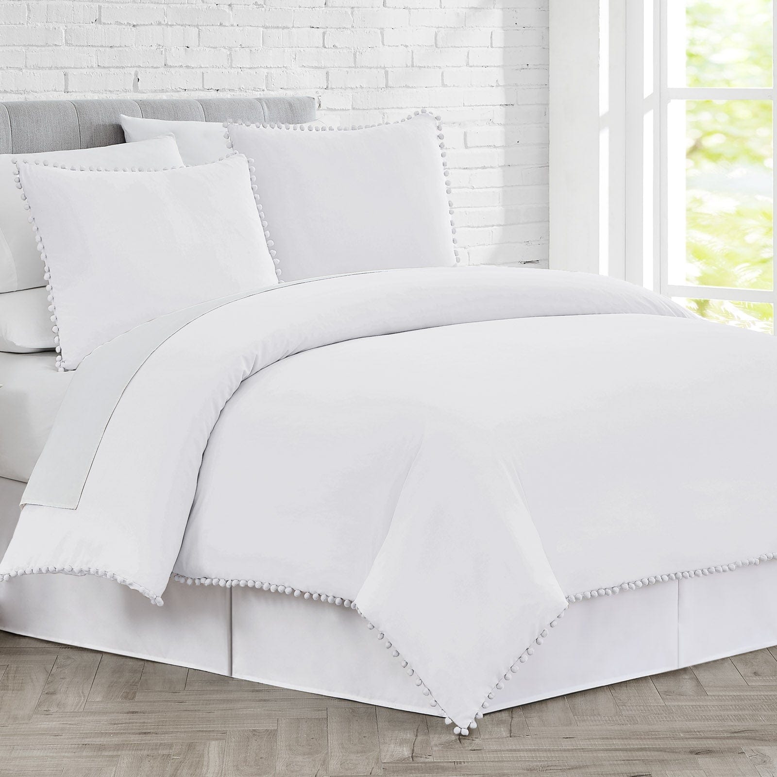 Side View of Pom-Pom Duvet Cover Set in Bright White#color_bright-white