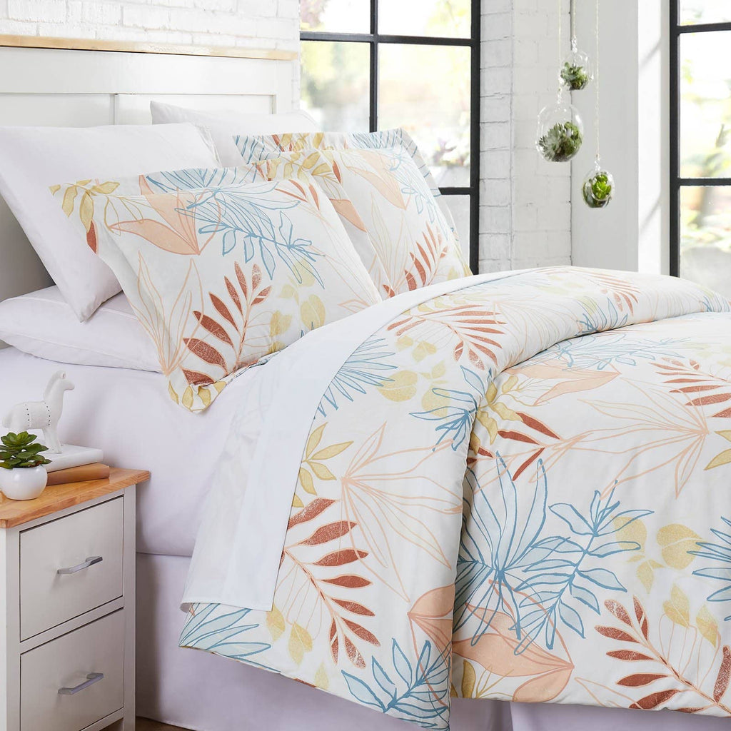 Angled View of Tropic Leaf Duvet Cover Set in cream#color_tropic-leaf-cream