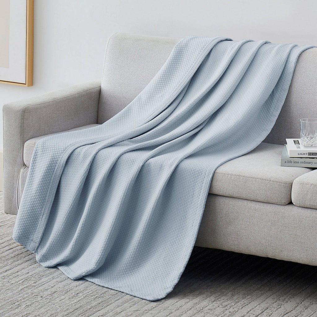 Milton Cotton Blankets and Throws on Couch in Blue#color_milton-blue