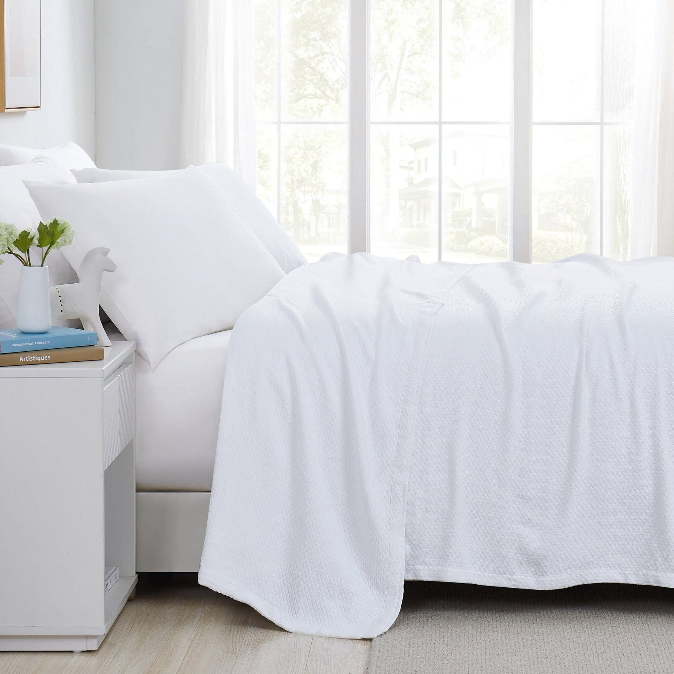 Side View of Milton Cotton Blankets and Throws in White#color_milton-white