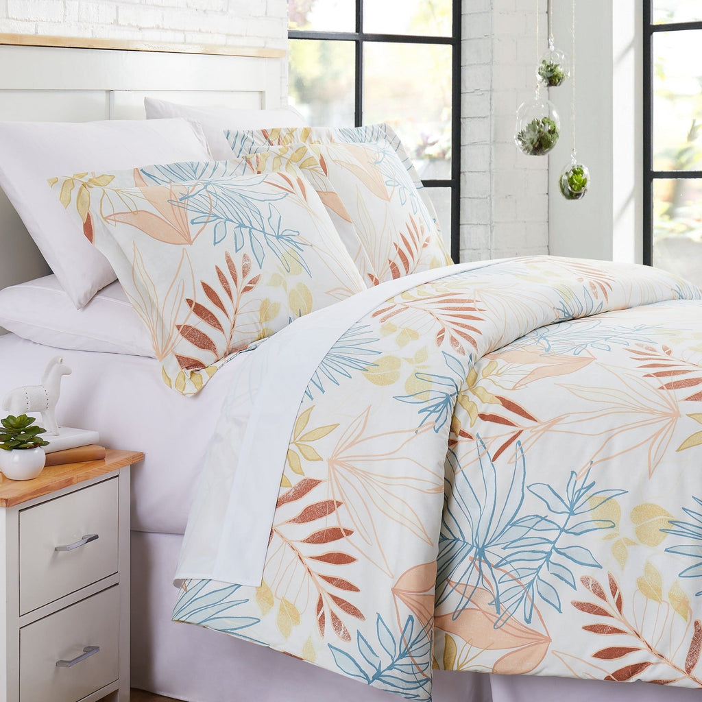 Angled View of Tropic Leaf Comforter Set in Cream#color_tropic-leaf-cream