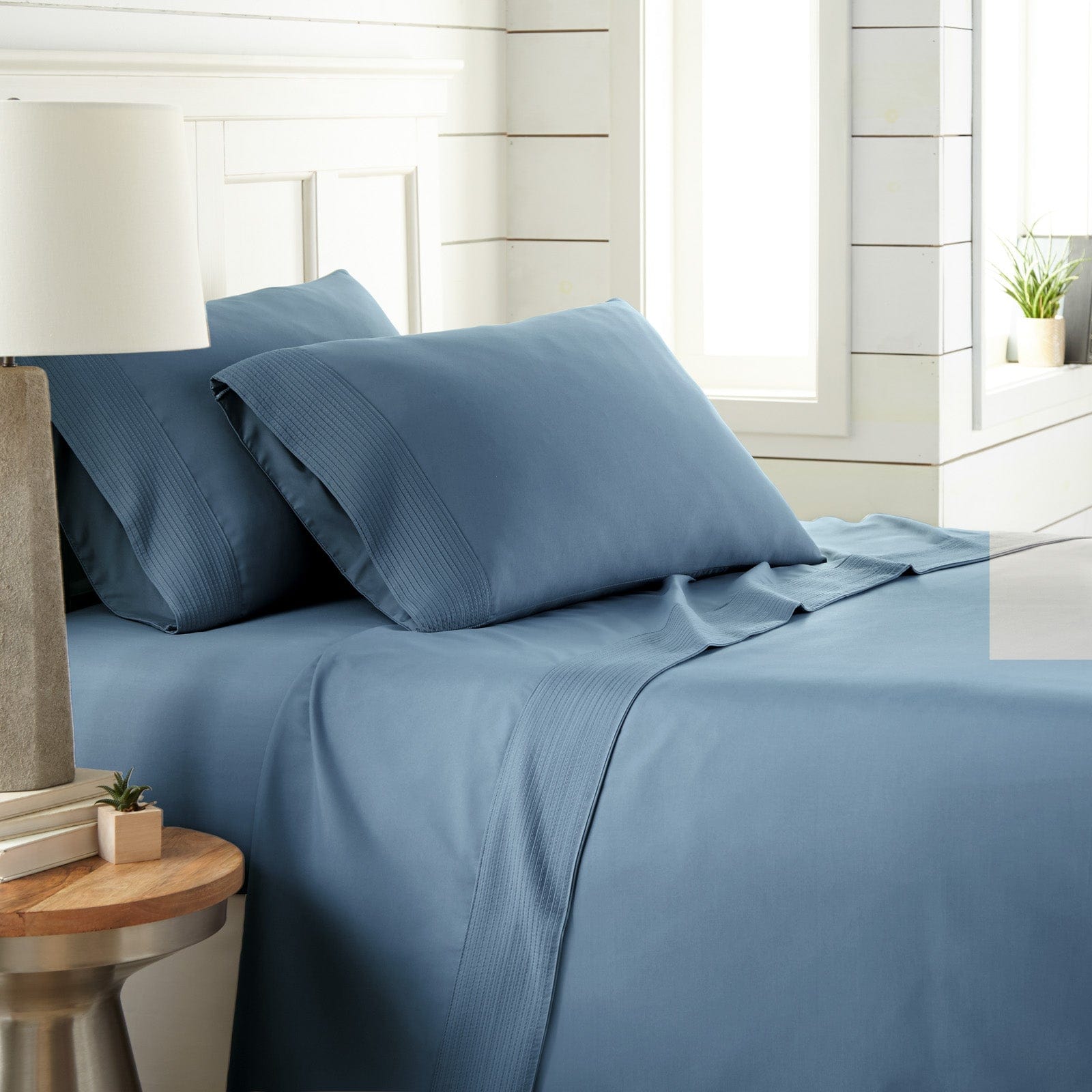 Side View of Vilano Extra Deep Pocket Pleated Sheet Set in Coronet Blue#color_vilano-coronet-blue