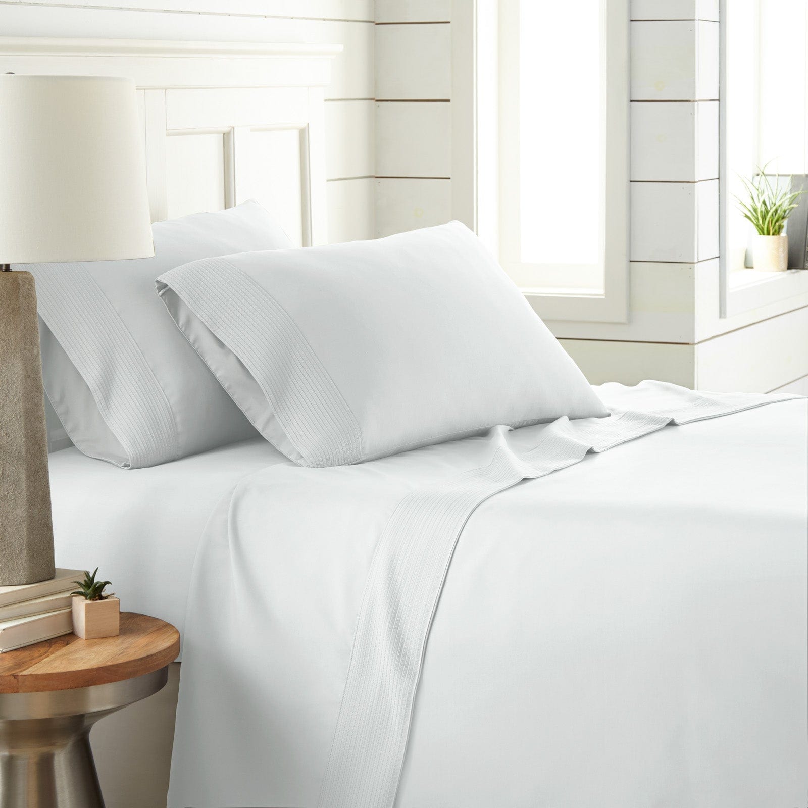 Side View of Vilano Extra Deep Pocket Pleated Sheet Set in White#color_vilano-bright-white